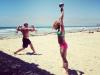 CrossFit Kettlebell Swings On Beach